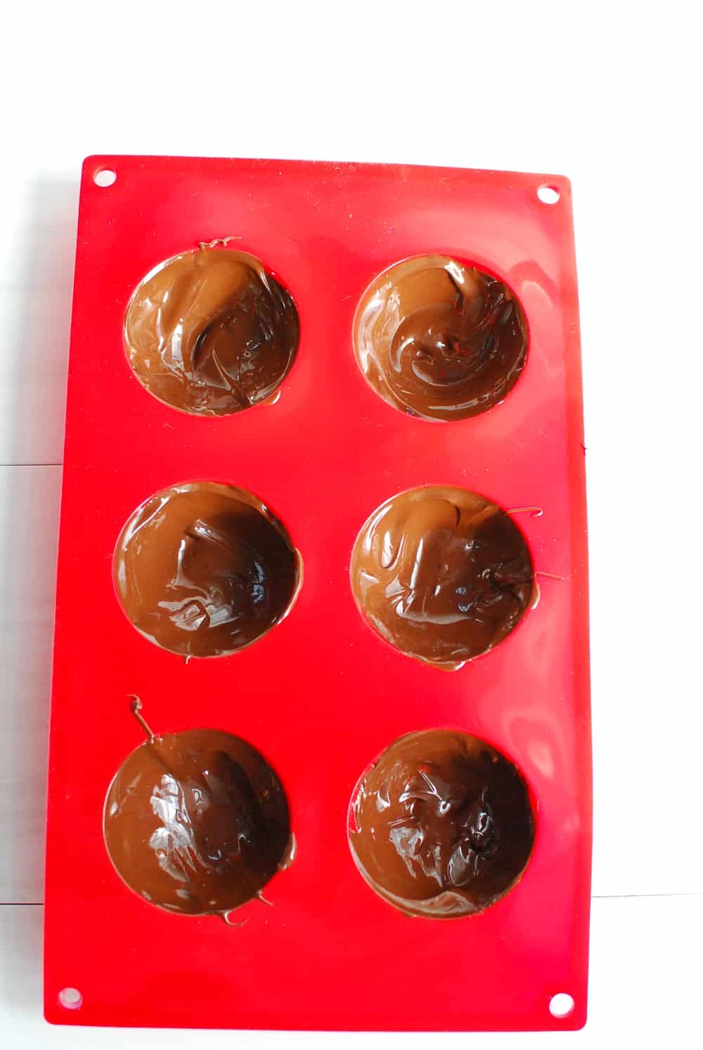 a silicone mold filled with melted chocolate