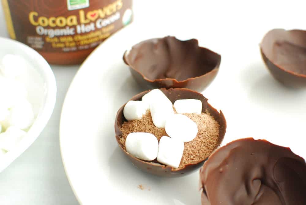 a chocolate dome filled with hot chocolate and marshmallows