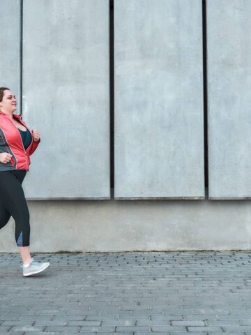 a female beginner jogger running outside