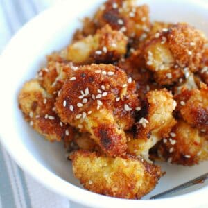 teriyaki cauliflower in a white bowl