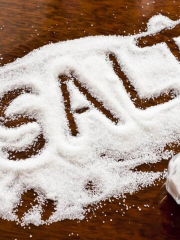 Salt written on counter in spilled salts