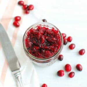 Cranberry chia jam in a small mason jar.