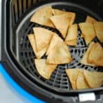 Air fryer tortilla chips after they were just cooked still in the air fryer basket.
