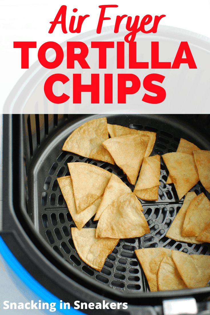 Air fryer tortilla chips in the air fryer basket with a text overlay.