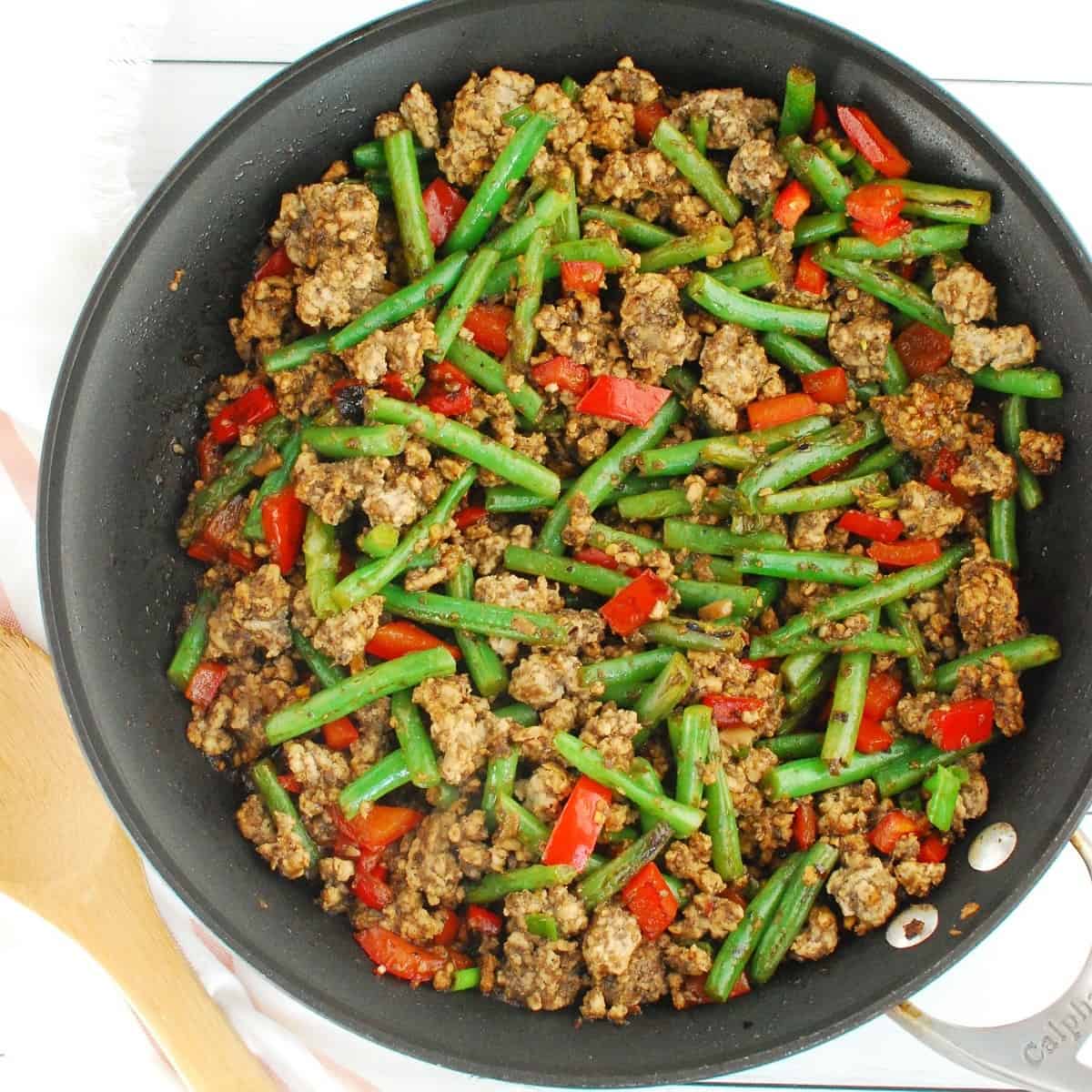 Ground pork stir fry in a large skillet.