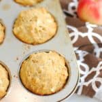 Apple cheddar muffins baked in a pan.