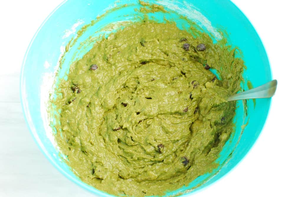 A mixing bowl with matcha banana bread batter, after all ingredients have been mixed together.