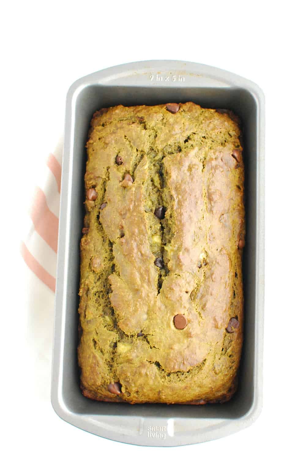 A loaf pan with cooked banana bread.