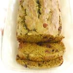 A close up of two slices of matcha banana bread that were cut from the loaf on a plate.
