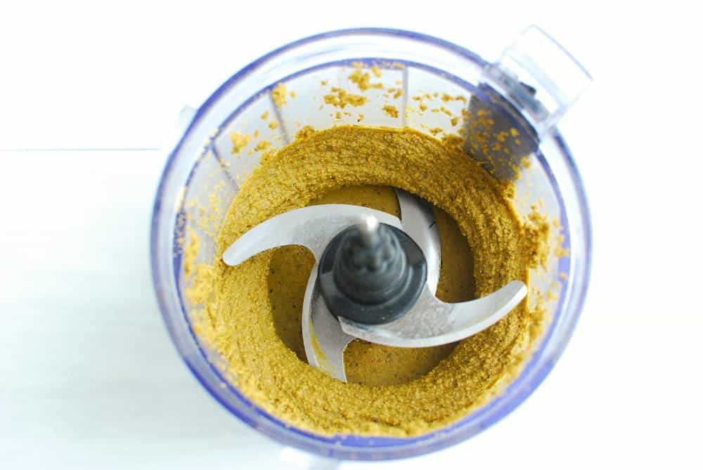 Homemade pistachio butter in a small food processor.