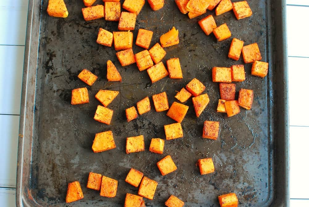 A sheet pan with roasted butternut squash.