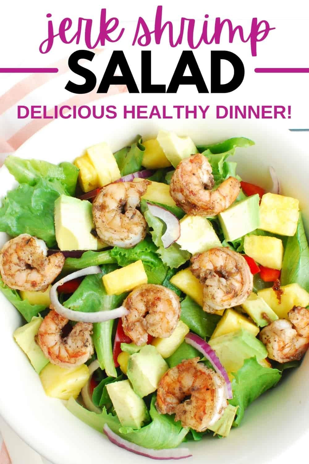 An overhead shot of a bowl of jerk shrimp salad.