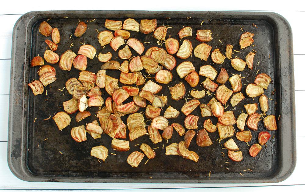 Roasted chioggia beets on a baking sheet after cooking.