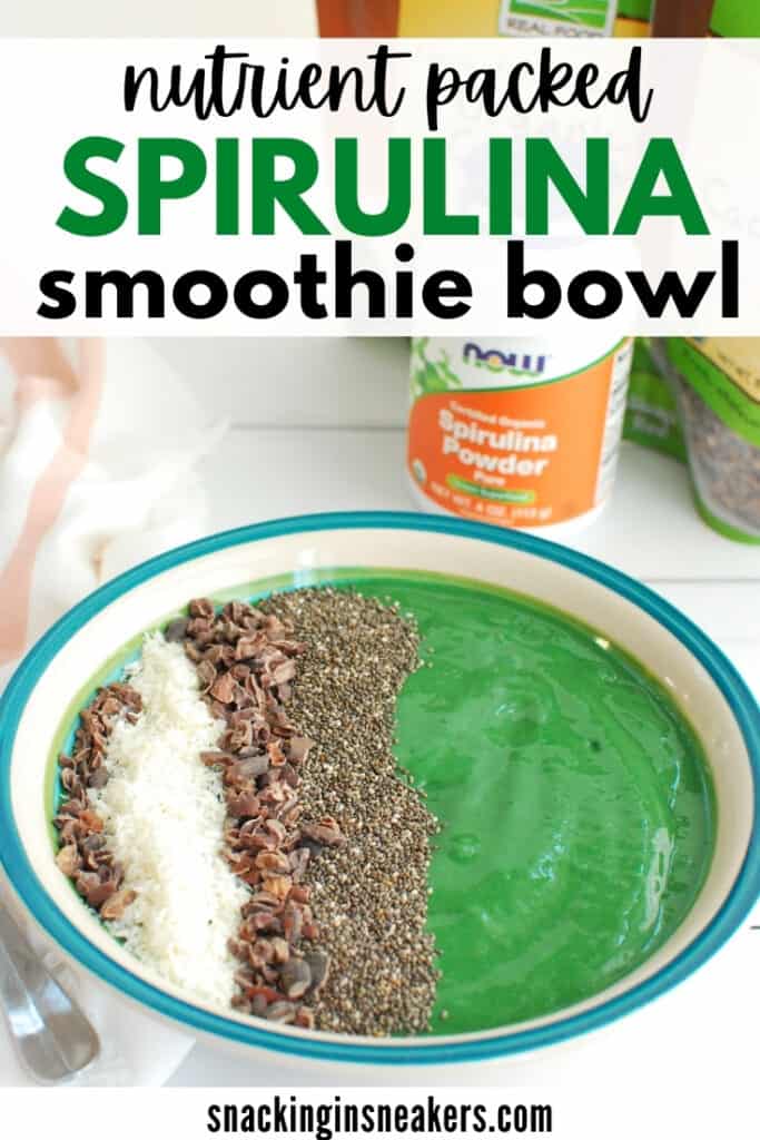 A spirulina smoothie bowl topped with chia seeds, coconut, and cacao nibs.