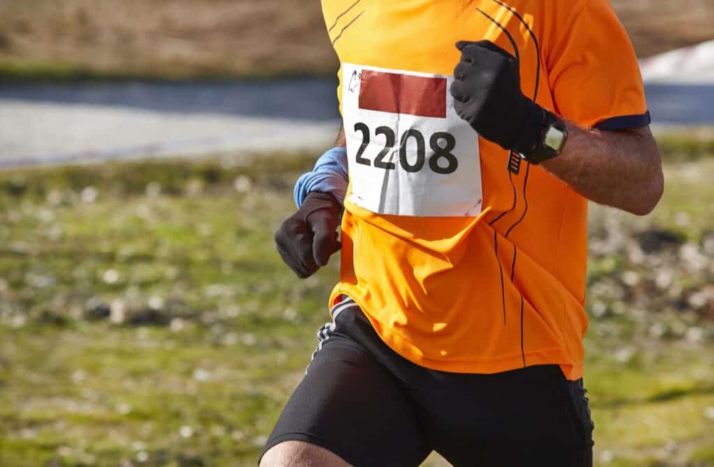An intermediate 5K runner during a race.