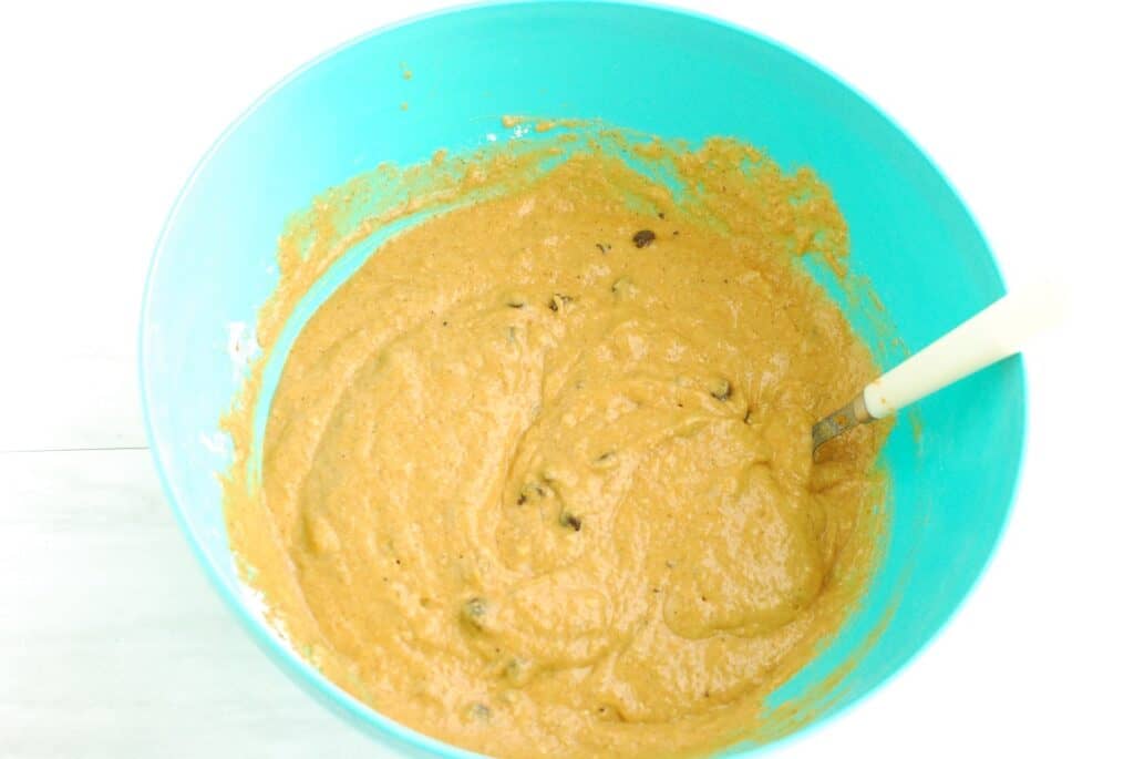A bowl with muffin batter after chocolate chips were folded in.