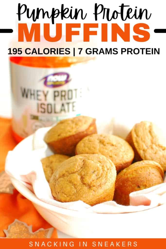 A bowl lined with a napkin filled with pumpkin protein muffins.