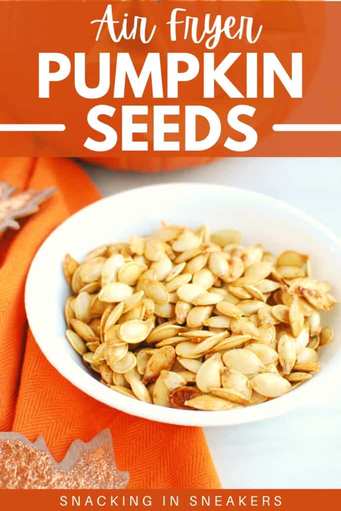 A bowl of air fryer pumpkin seeds next to an orange napkin with a text overlay.