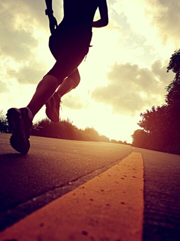 A runner on the road training for a 5K.