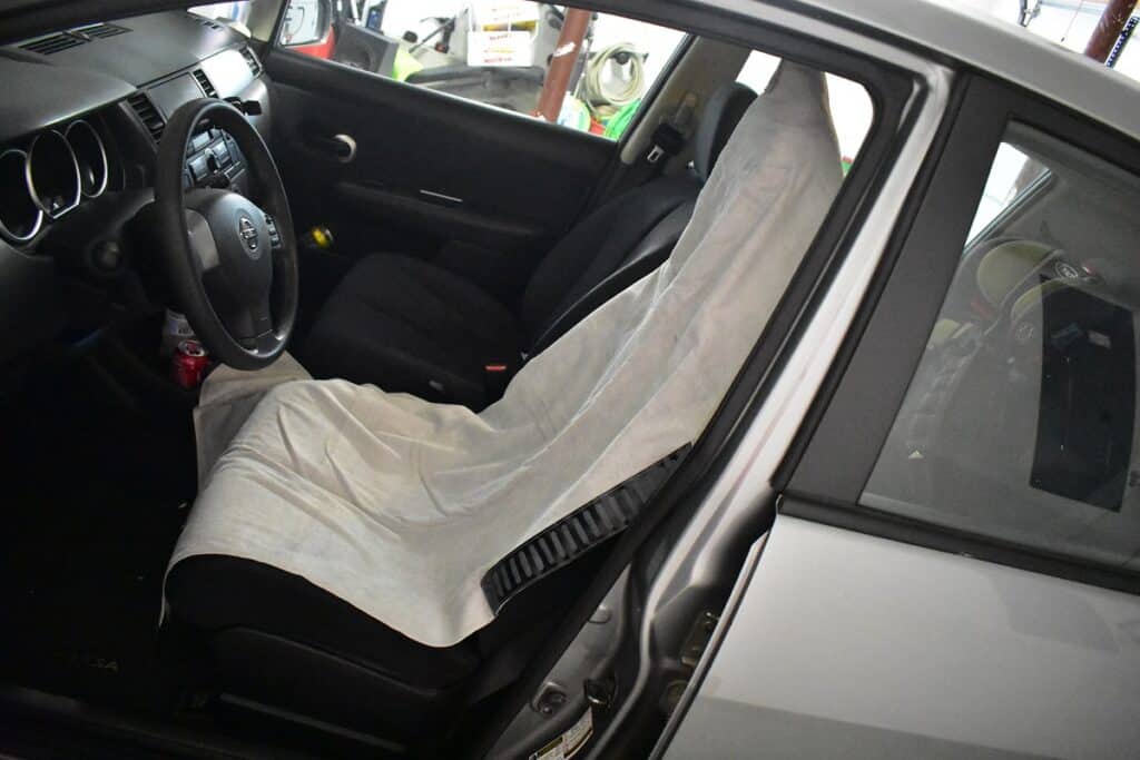 Orange mud transition wrap over a seat in a car.