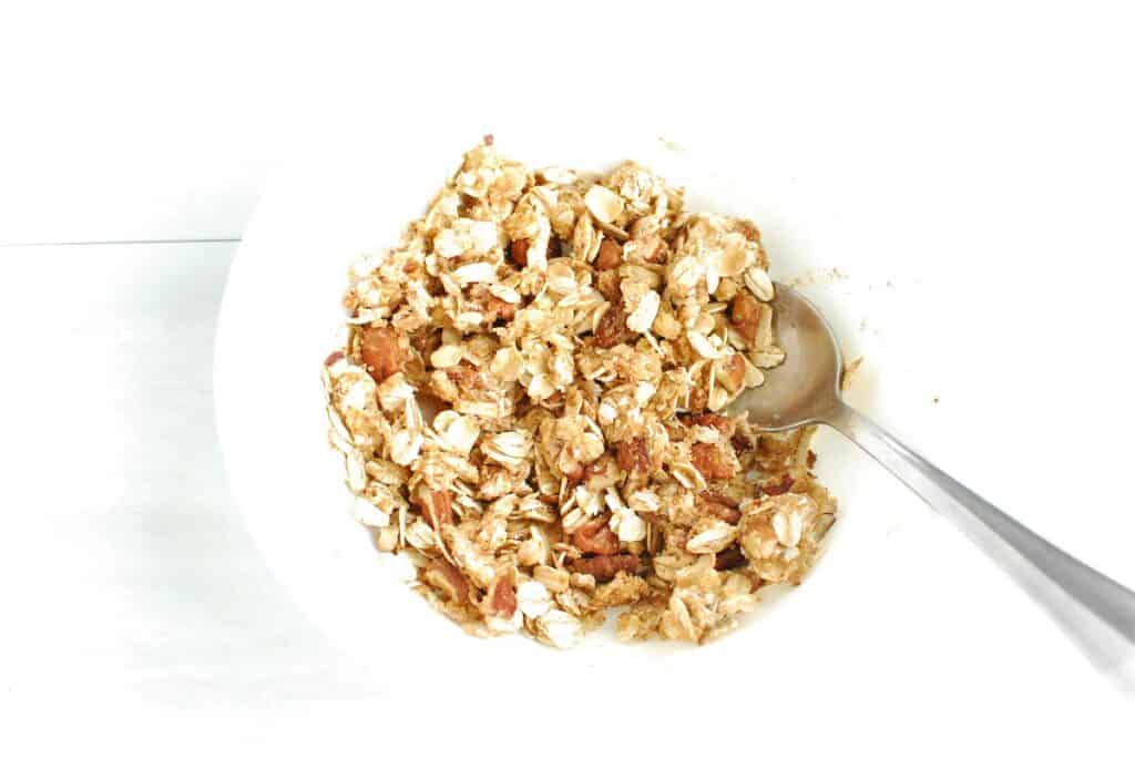 The oat and brown sugar topping mixtured together in a small bowl.