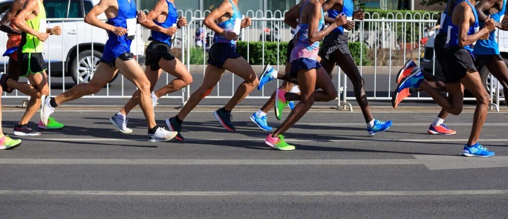 A group of people running in a road race.