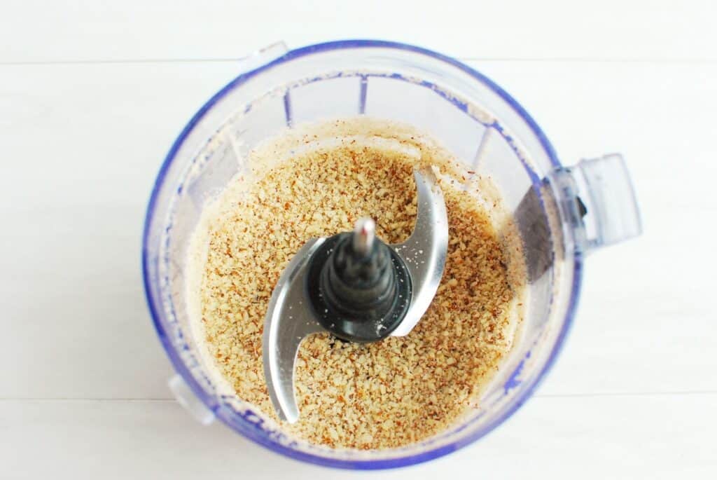 Almonds pulsed into a coarse flour in a food processor.