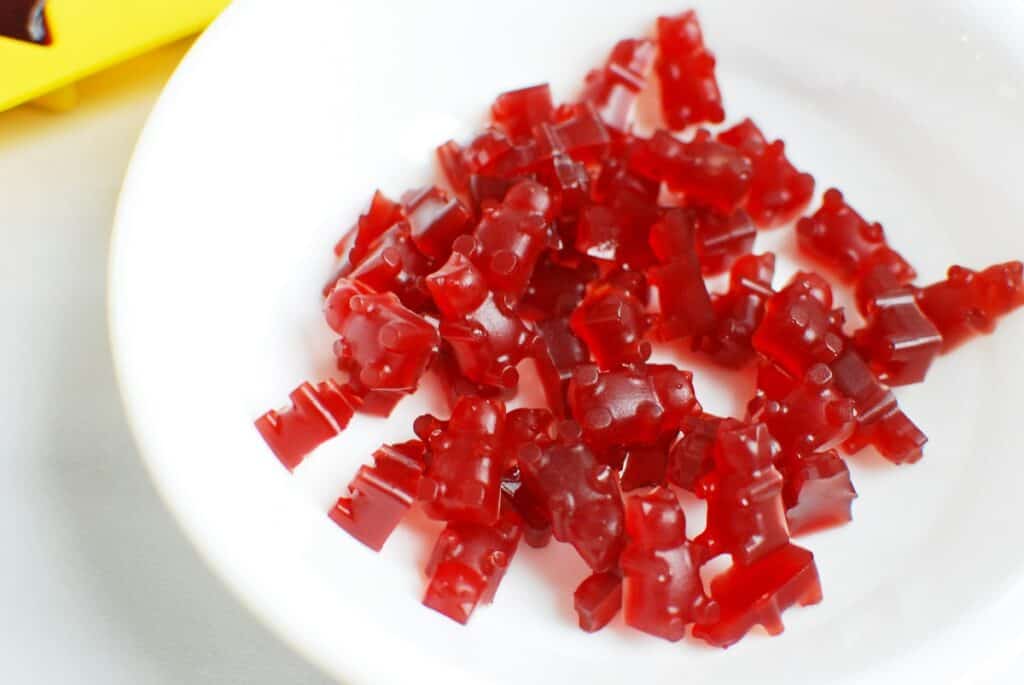A bowl filled with tart cherry juice gummy bears.