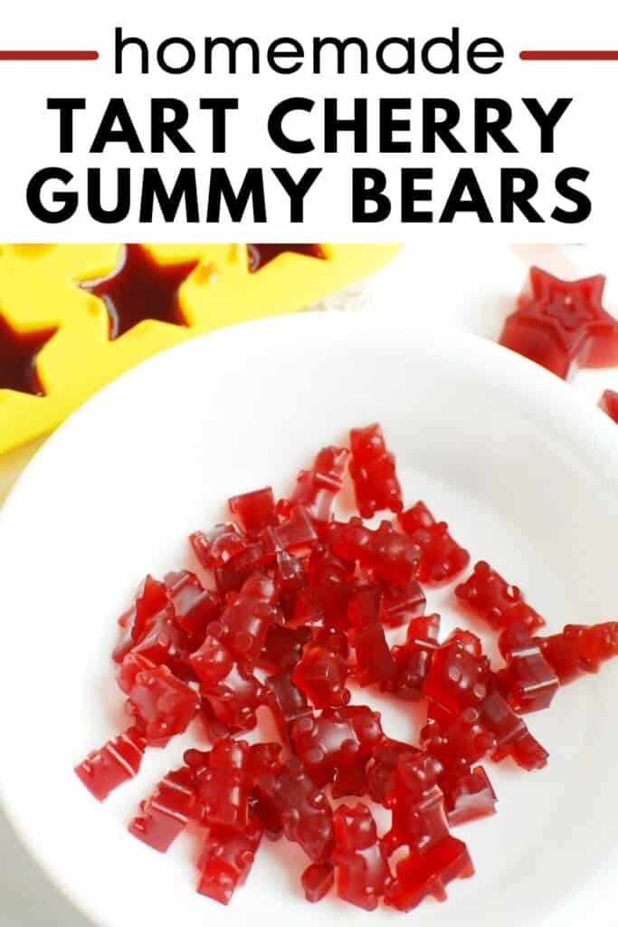 A bowl of cherry gummy bears next to gummy molds.