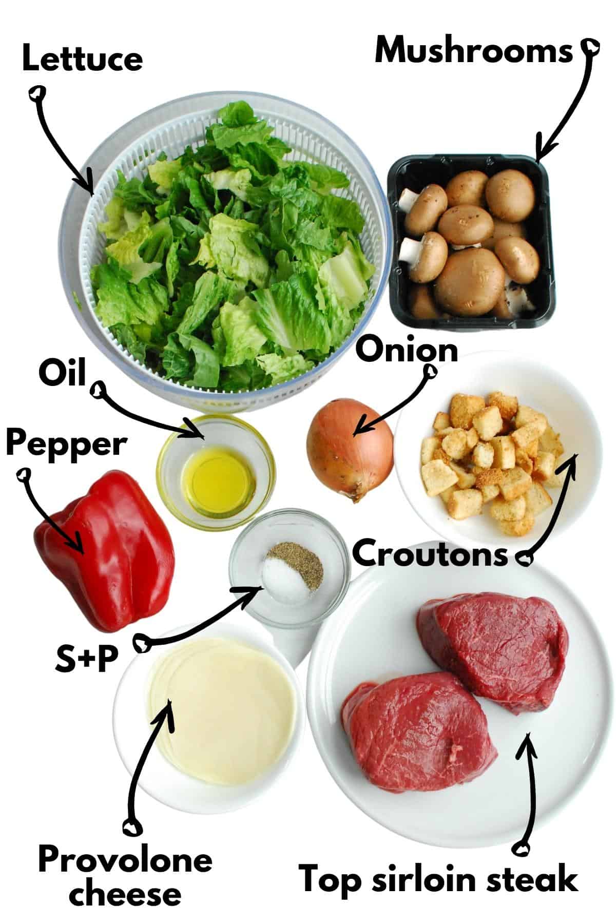 Lettuce, mushrooms, onion, pepper, oil, salt, pepper, steak, cheese, and croutons.