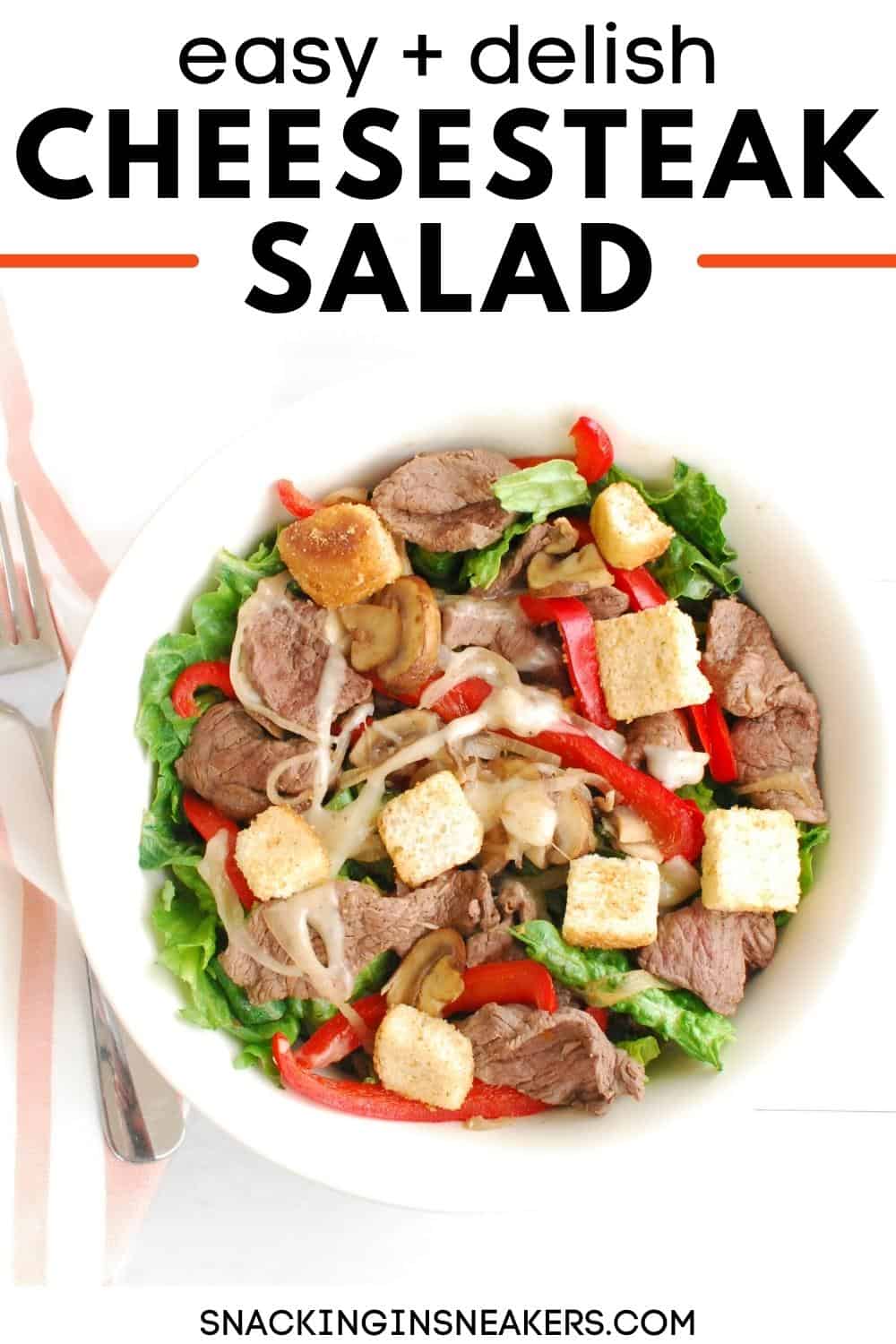 A bowl of cheesesteak salad with a text overlay for Pinterest.