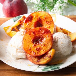 Air fryer peaches served over ice cream.