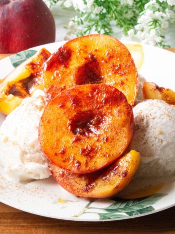 Air fryer peaches served over ice cream.