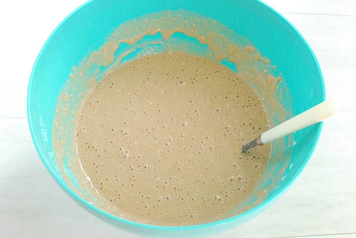 Chocolate milk waffle batter in a bowl.