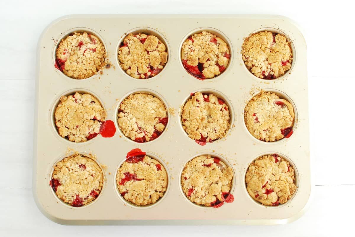 Cooked strawberry watermelon rind pies in a muffin tin.