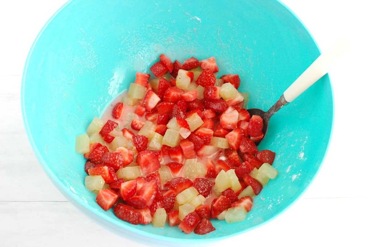 Strawberries, watermelon rind, lemon juice, sugar, salt, and cornstarch mixed together in a bowl.