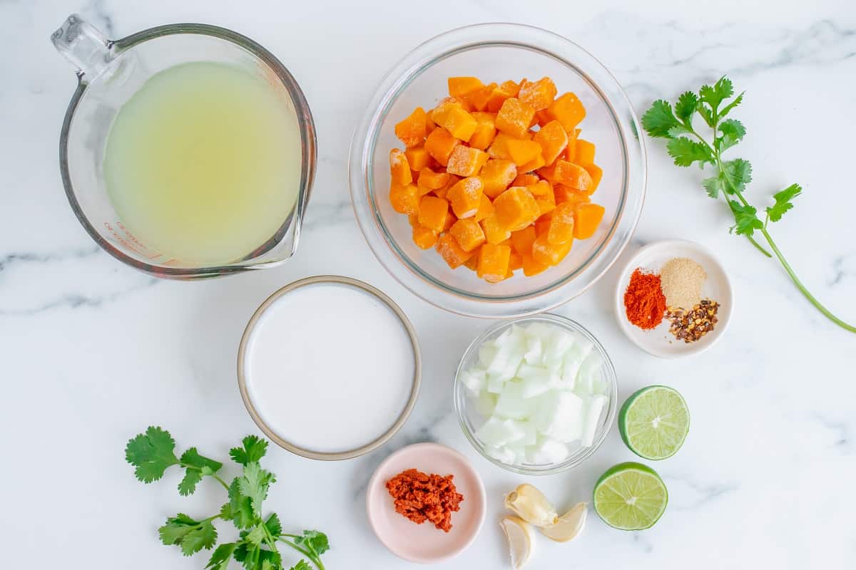 Broth, coconut milk, butternut squash, seasonings, onion, curry paste, lime, cilantro.