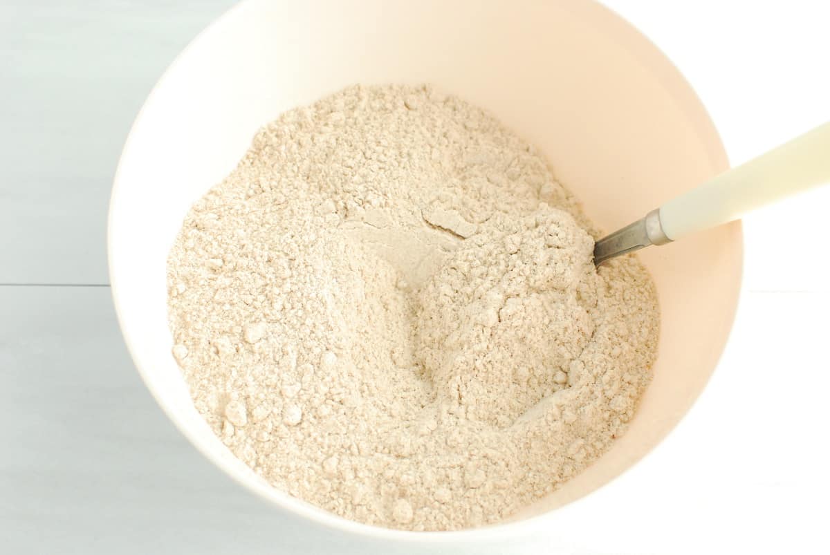 Flour mixed with baking powder and salt in a bowl.