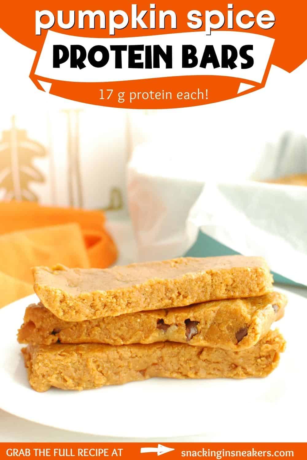 Several pumpkin protein bars on a plate with a text overlay with the name of the recipe.