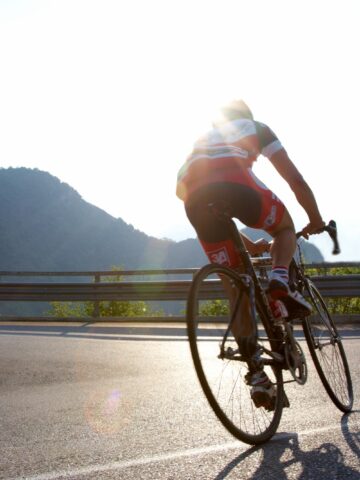 A cyclist riding on a road.