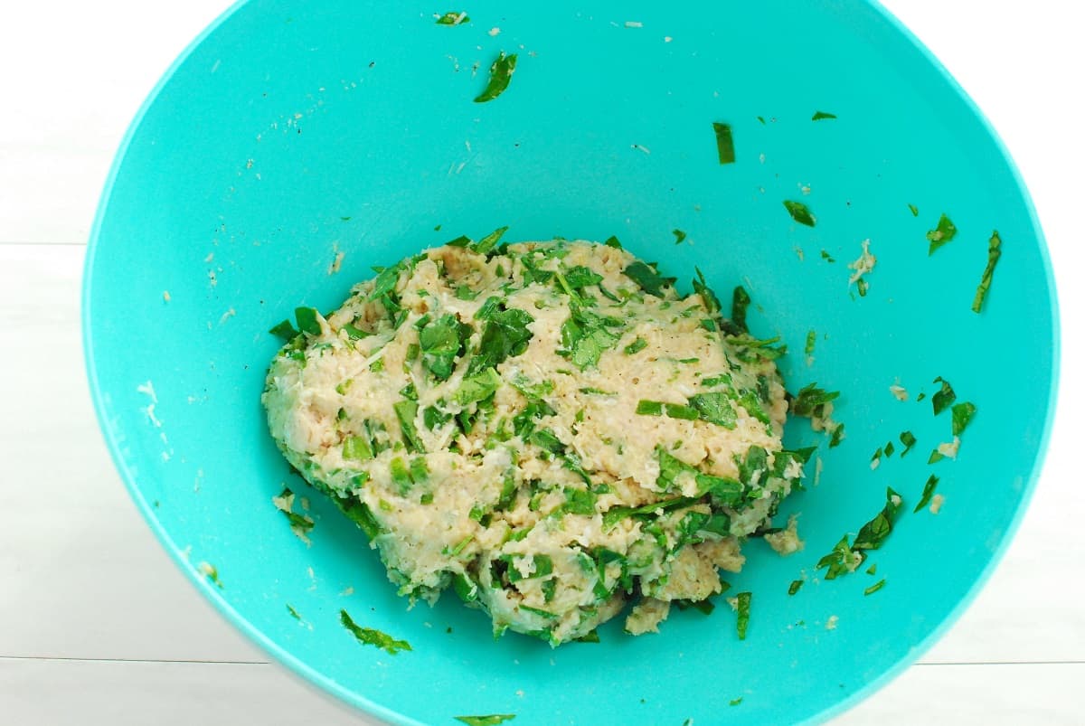 Meatball ingredients mixed together in a bowl.