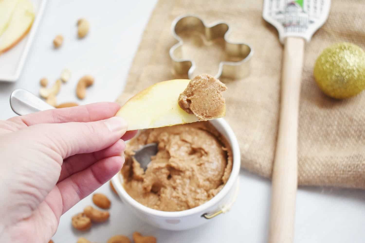 Sliced apple topped with homemade almond cashew butter.