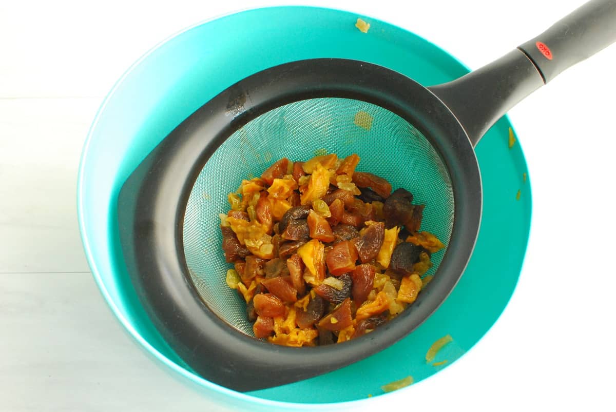 Dried fruit in a strainer.