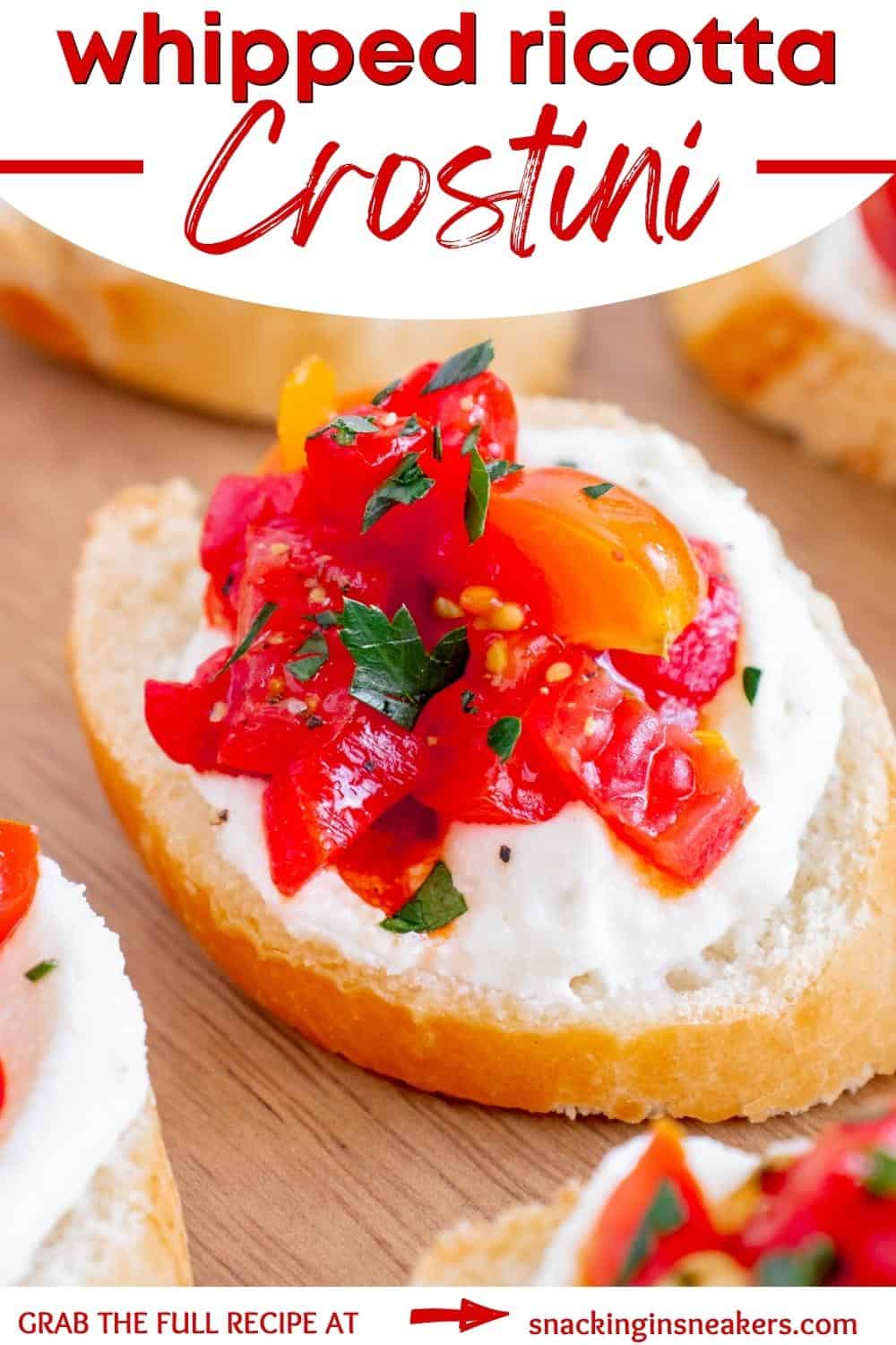 Whipped ricotta crostini topped with tomato and roasted red peppers.