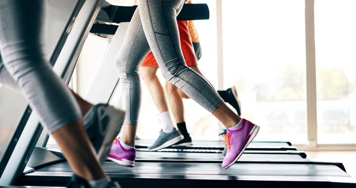 A woman's legs running on the treadmill.