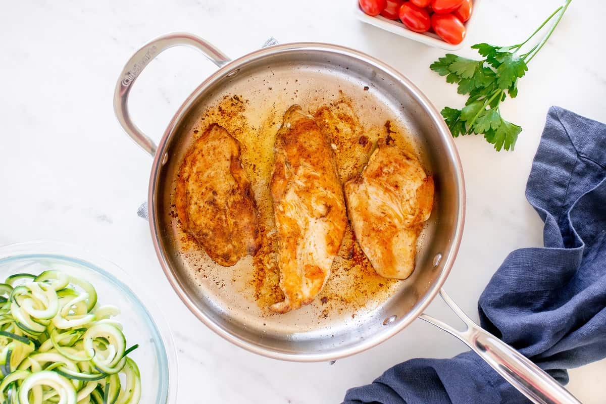 Chicken cooked in a skillet.