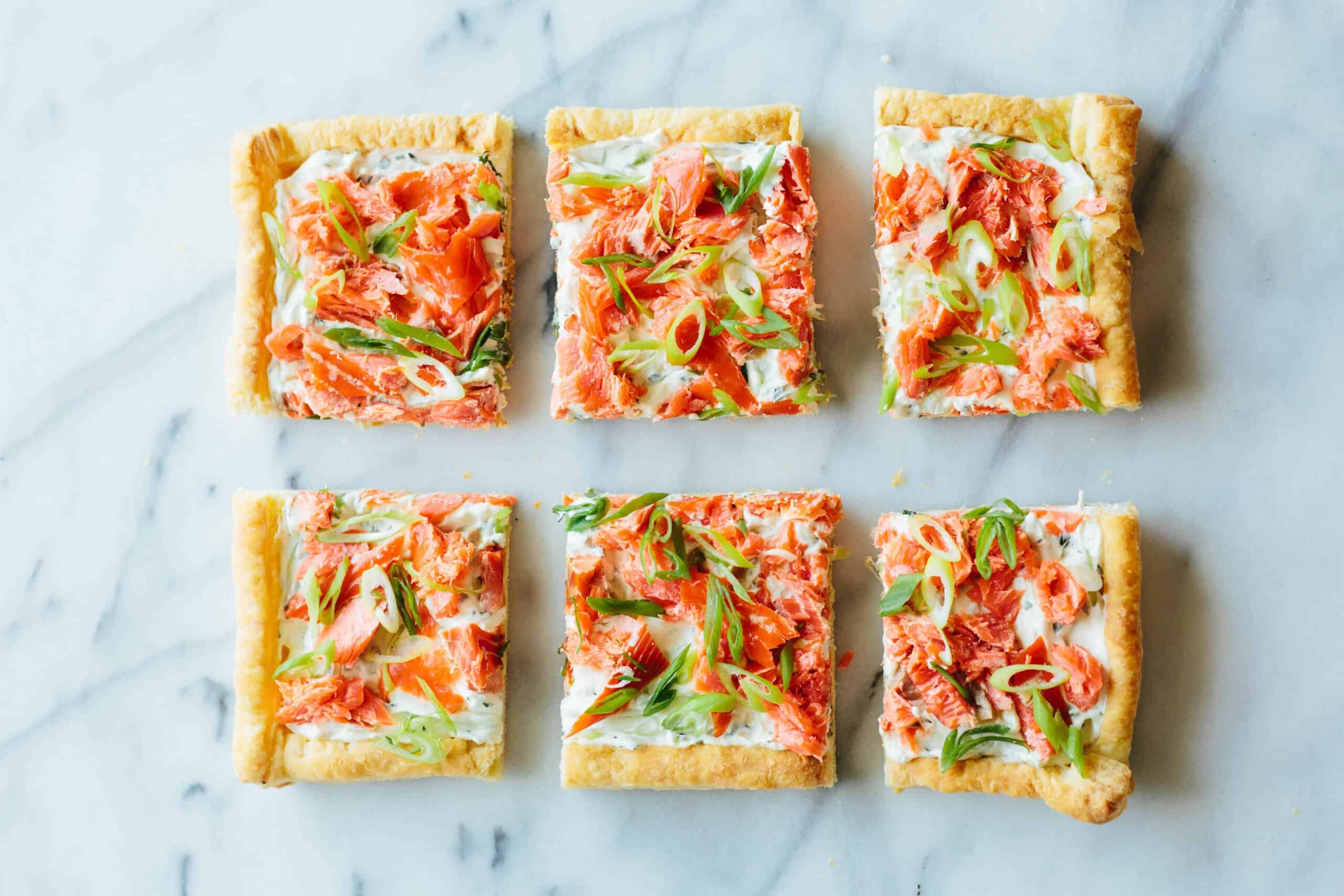 Everything bagel quinoa cakes topped with smoked salmon and crème fraiche.