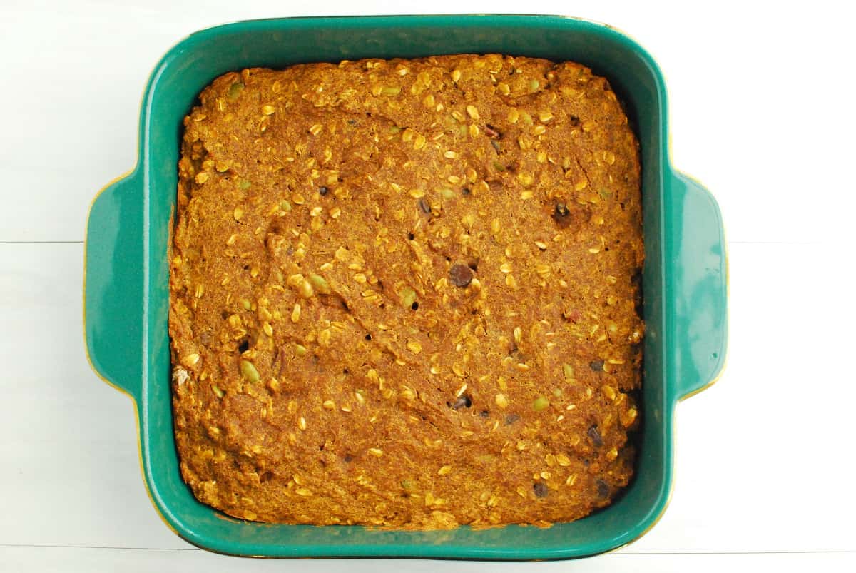 An 8x8 dish with healthy pumpkin bars baked in it.