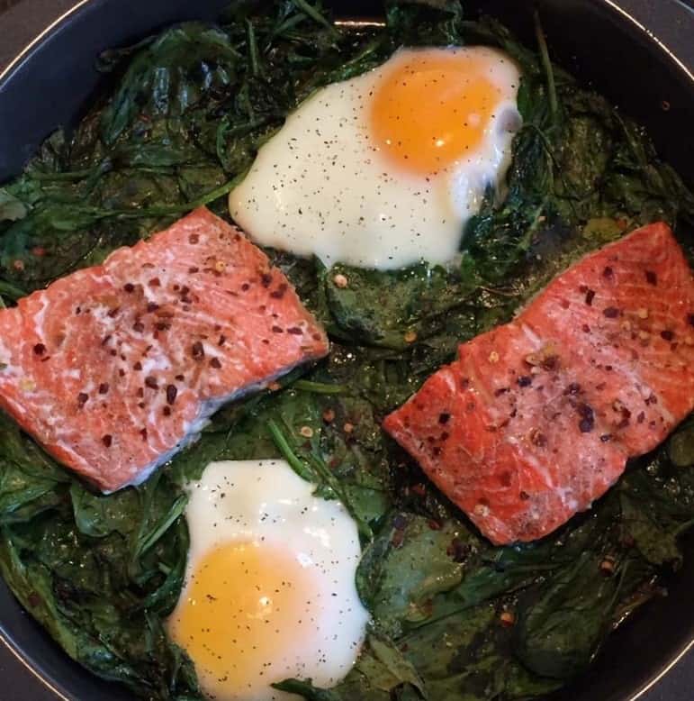 A skillet bake with spinach, eggs, and salmon.