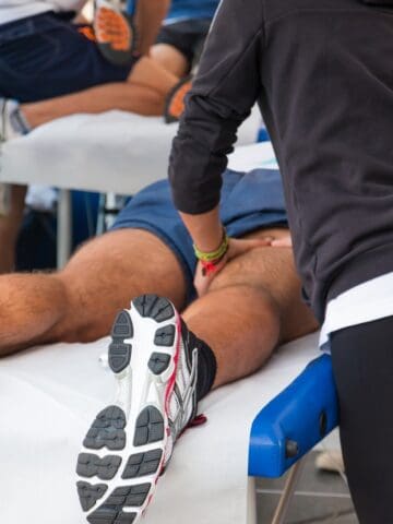 An athlete getting a massage after a road race.